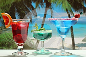 Alcoholic cocktails with fruit on the beach photo