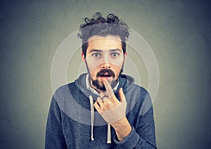 Closeup of an amazed stunned young man