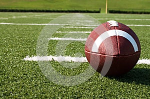 Closeup of American Football on Field