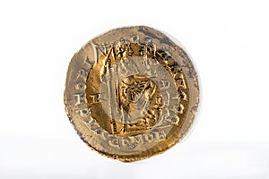 Closeup of an ancient Roman gold solidus coin of Emperor Honorius.