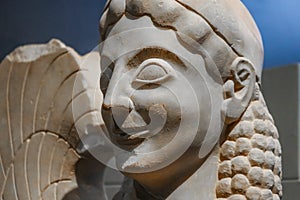 Closeup of an ancient sphinx in Grecian ruins - a treacherous and merciless mythical creature with the head of a human and the bod