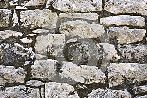 Closeup of ancient stone wall texture of Mayan Coba Ruins, Mexico