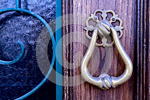 Closeup antique door with gold bronze door handle