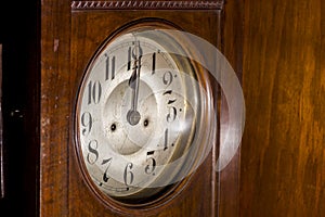 Closeup of an antique pendulum clock