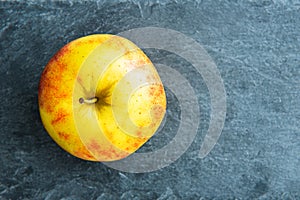 Closeup on apple on stone substrate