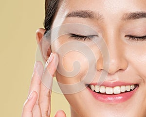 Closeup ardent young woman posing beauty gesture with clean fresh skin.