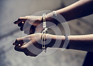 Closeup of arrested hands with handcuffs