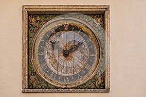 Closeup, Artful clock on facade of Holy Spirit Church, Tallinn, Estonia