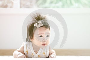 Closeup asian baby girl in cute motion with copy space