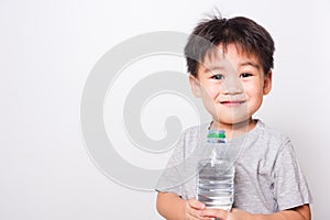 Closeup Asian face, Little children boy drinking water from Plastic bottle