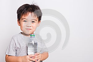 Closeup Asian face, Little children boy drinking water from Plastic bottle