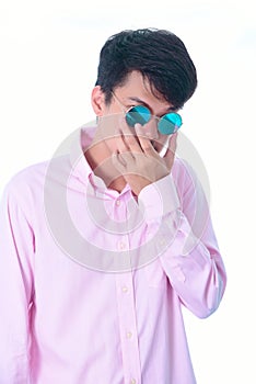 Closeup Asian man wearing fashionable sunglasses , black hair and short hair on white blackground , handsome Asian young man