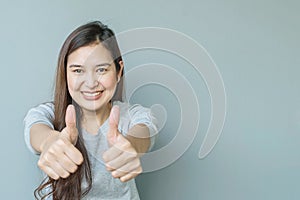 Closeup asian woman with admire motion with smile face on blurred cement wall textured background with copy space