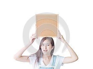 Closeup asian woman with cork board show on above of head isolated on white background with clipping path