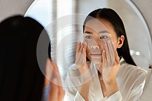 closeup of asian woman feel sad, her skin is oily