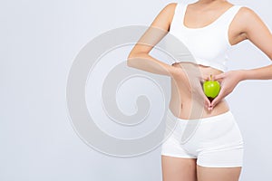 Closeup asian woman holding green apple fruit shape heart and beautiful body diet with fit isolated on white background