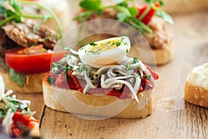 Closeup on assorted tappas with different toppings