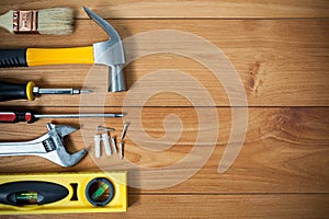 Closeup of assorted work tools on wood