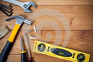 Closeup of assorted work tools on wood