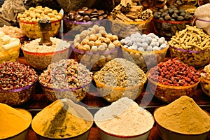 Closeup of an assortment of dried fruits and vegetables and spices for sale