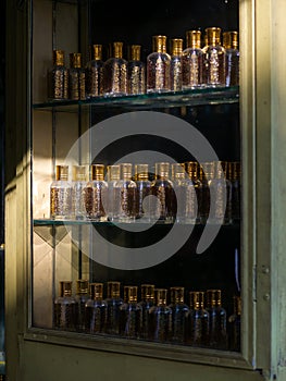 Closeup of Attar or perfume glass bottles in a display in a shop