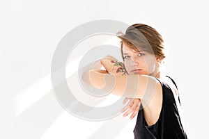 Closeup of attractive pensive young woman looking at camera