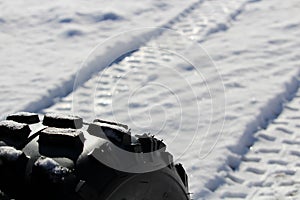 Closeup of an ATV Tire and it`s Tracks photo