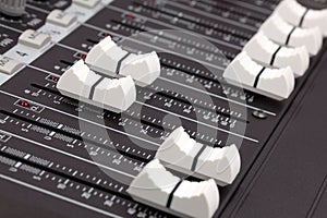 Closeup of audio mixing console.