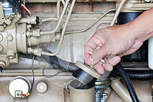 Closeup of an auto mechanic working on a Generator