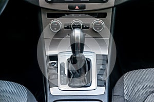 Closeup of automatic transmission inside car salon