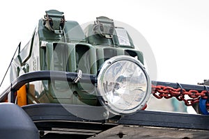 Closeup auxiliary light reserve gasoline canisters roof