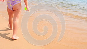 Closeup Back Little Girl in Safety Armbands Goes to Sea