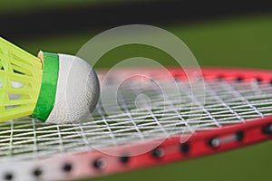 Closeup background with badminton shuttlecock on a racket