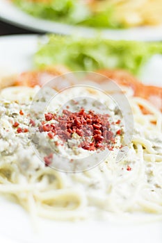 Closeup bacon fried on carbonara spaghetti