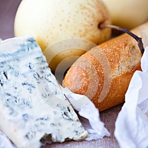 Closeup of baguette,blue cheese and pear