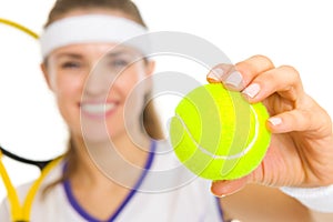 Closeup on ball in hand of female tennis player