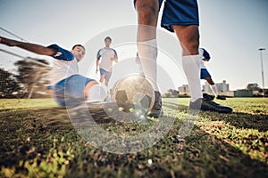 Closeup, ball and soccer with men, tackle and exercise with sports, competition and training. Zoom, football and healthy