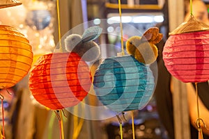 Closeup of Bamboo lantern with stuffed rabbit and flashing lights