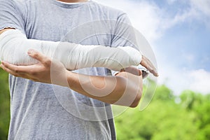 Closeup of bandaged arm in the park photo