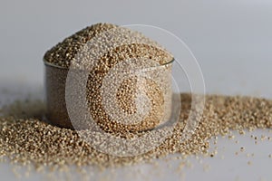 Closeup of banyard millet, a healthy grain, in a glass bowl filled to the brim