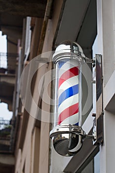 Closeup of barber shop sign on a building