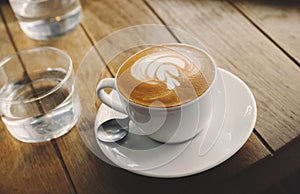 Closeup of barista made coffee with froth art