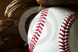 Closeup of baseball ball and gloves