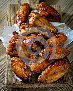 Closeup Bbq chicken wings with sauce, grilled and tasty finger f