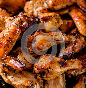 Closeup Bbq chicken wings with sauce, grilled and tasty finger f