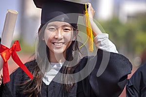 Closeup beautiful asian graduated student girl  holding diploma