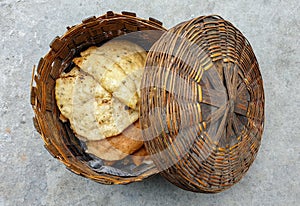 Closeup of beautiful bamboo bread, roti basket with fried roti and selective focus in Himachal pradesh