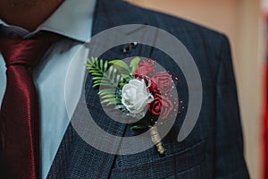 Closeup of a beautiful Buttonhole on a suit of an elegant man