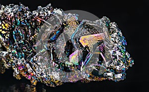 Closeup of beautiful colorful silicon carbide crystals on a black background