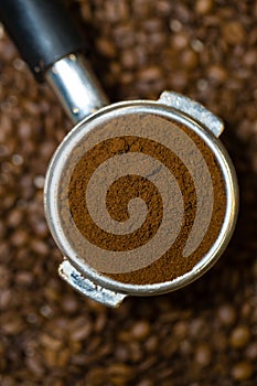 Closeup, Beautiful espresso portafilter full of fine arabica coffee grounds
